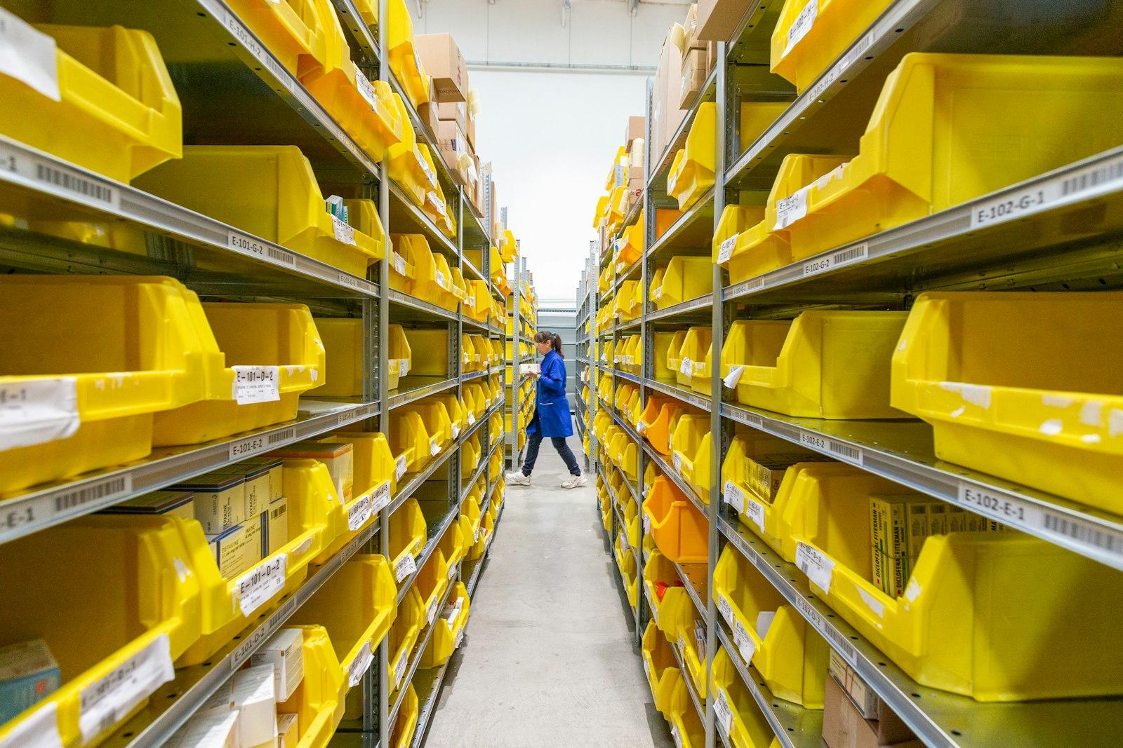 A stocktaker recording stock levels on a handheld device